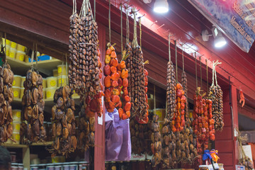 Caleta Angelmo - Puerto Montt, Chile / 17 February  - 2019: hanging seaweed and smoked or dried seafood at a stall in a local fish market