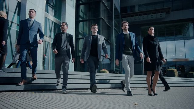 Multicultural Diverse Office Managers and Business People Walking in Front on the Camera. They Look Smart and Successful. Pedestrians are Dressed Smartly. Business Department Walking in Downtown. 