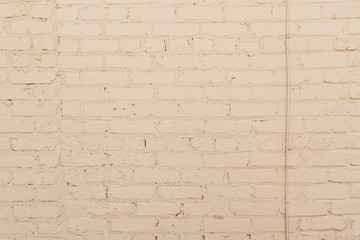 Fototapeta premium Cream brick wall background texture