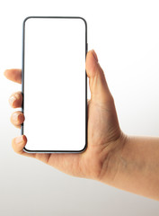 Hand holding black Smartphone with blank screen on white background