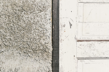 Grunge concrete white wood distressed door background texture