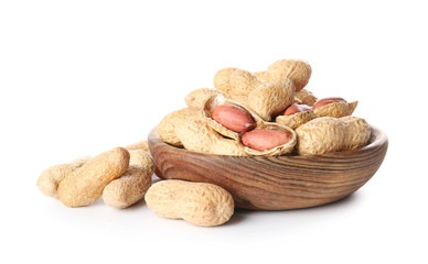 Bowl with peanuts on white background