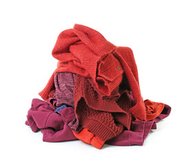 Heap of different clothes on white background