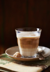 Coffee with milk on dark background. 