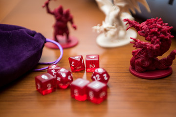 Close up photography of role playing game dices and miniatures.