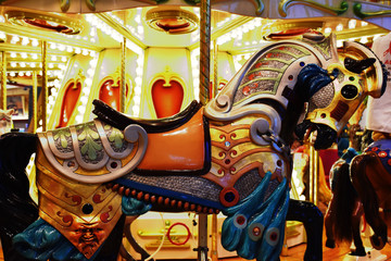 Carousel horse colorful closeup with lights,