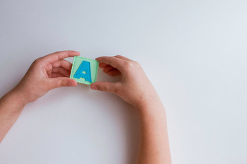 Alphabet. Letter A. Hands of the child hold letters. Learn ABC alphabet with baby.