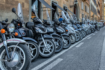 A pick of a very long row of parked motorbikes 