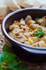 CHAMPINONES AL AJILLO, SPANISH GARLIC MUSHROOMS roasted in the oven with fresh herbs.