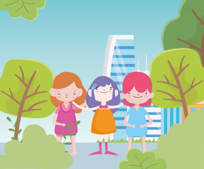 Obraz na płótnie Canvas happy childrens day cute group little girls in city street trees