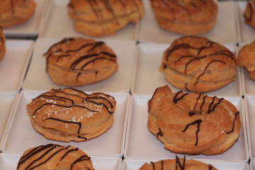 Profiteroles decorated with chocolate