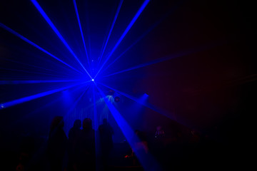 Abstract blue strobe lighting a concert