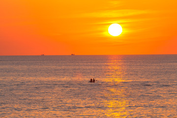 Naklejka na ściany i meble red sunset above the sea at Kata beach Phuket Thailand