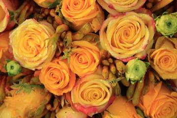 Obraz na płótnie Canvas Mixed yellow bridal roses