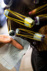 Perm rolling the hair onto curlers