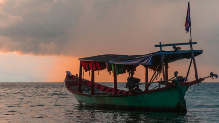 Fototapeta na wymiar Koh Rong Island, Cambodia at Sunrise. strong vibrant Colors, Boats and Ocean