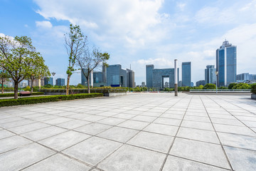 Panoramic skyline and buildings with empty square floor.