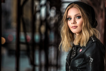 Urban style girl standing near a gangway 