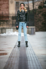 urban style girl standing alone on an empty street of novi sad