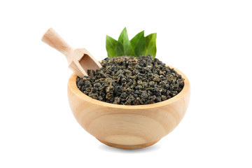 dry tea in wooden bowl an isolated on white background