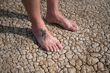 bare feet on dry desert