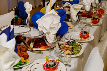 Dinner table setting with meal in restaurant.