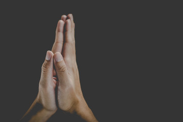 A woman is praying by her hands. Praying hands.