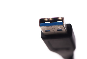 USB cable connector with blurred cable close up
