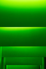 Illuminated green wall texture background. 