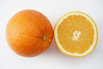 Ripe orange isolated on a light background. Selective focus