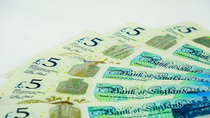 British £5  pounds sterling bills or banknotes
