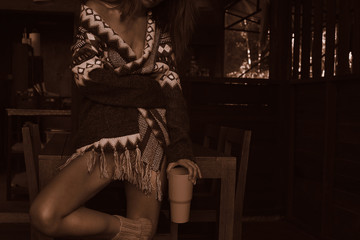 Human, beauty, art concept. Close up fragments of woman's body, drinking tea on wooden terrace....