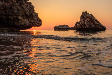 rock in the sea on the coast at dawn on the sea