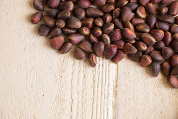 Pine pine nuts on a wooden background