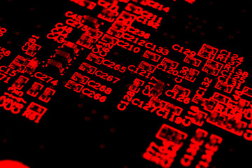 Macro shot of Circuit board with resistors microchips and electronic components. Computer hardware...