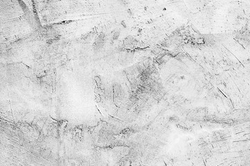Texture of a concrete wall with cracks and scratches which can be used as a background