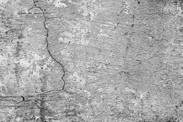 Texture of a concrete wall with cracks and scratches which can be used as a background