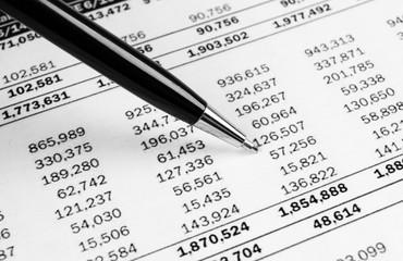 Obraz premium Financial concept. Calculator, pen and glasses on financial documents. Financial accounting. Balance sheets. Closeup of financial statements and annual reports. Business marketing
