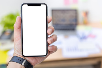 Mockup image blank white screen cell phone.woman hand holding texting using mobile at coffee shop.background empty space for advertise text.people contact marketing business,technology 