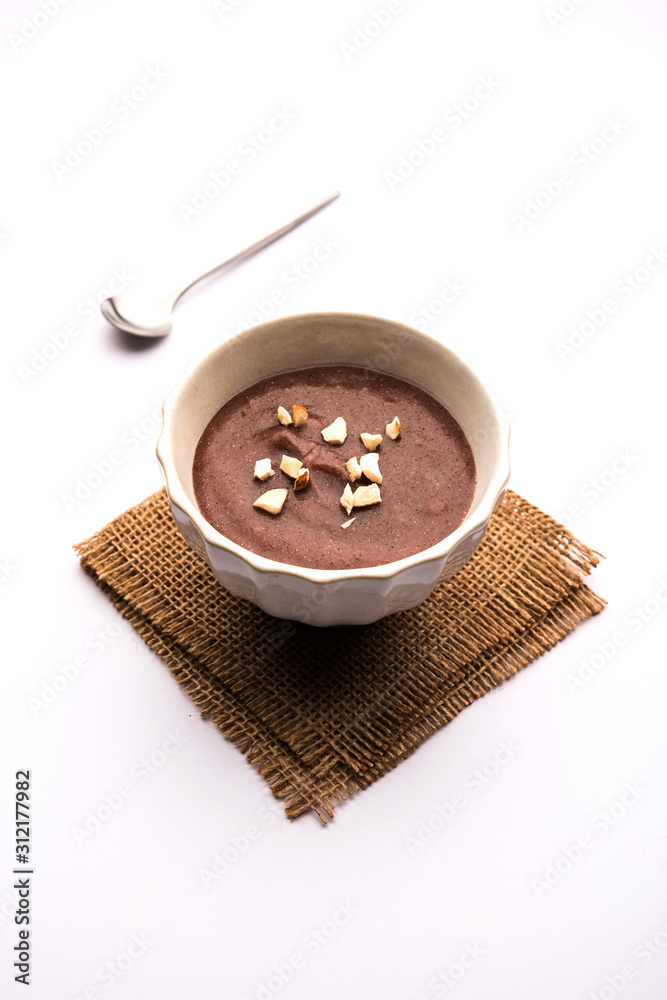 Canvas Prints Sweet Ragi Malt / Healthy Ragi Porridge in a bowl garnished with crushed dry fruits