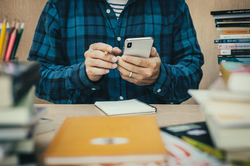 contact Asian businessman professional people thinking while working writing information documents in home offices at desk with computer,laptop,cell phone,business report chart