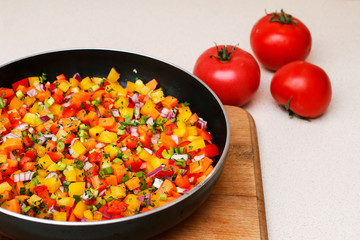 Mixed vegetables on a frying pan.