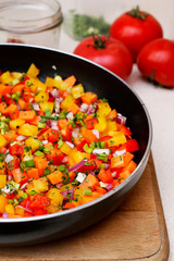 Mixed vegetables on a frying pan.