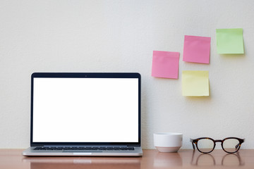 mockup image blank screen computer with white background for advertising text,hand man using laptop contact business search information on desk at home office.marketing and creative design