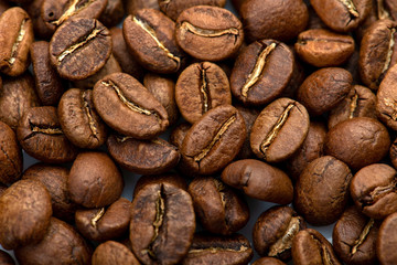 Coffee beans close-up background. Fresh roasted