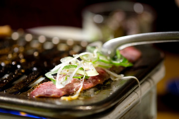 Cooking beef barbecue on grilled stove in restaurant