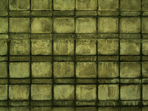 The texture of the wall of concrete blocks. Old concrete wall. Abstract green grunge background. Moldy concrete wall. Distessed background.
