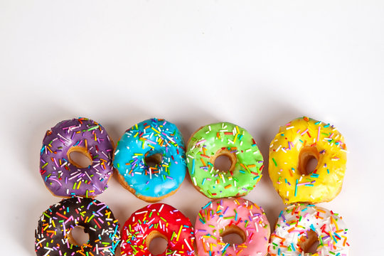 colorful doughnuts white background studio