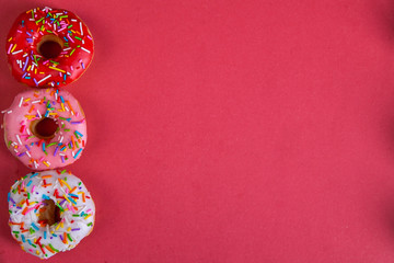 colorful doughnuts red background studio
