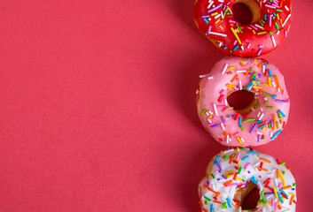 colorful doughnuts red background studio